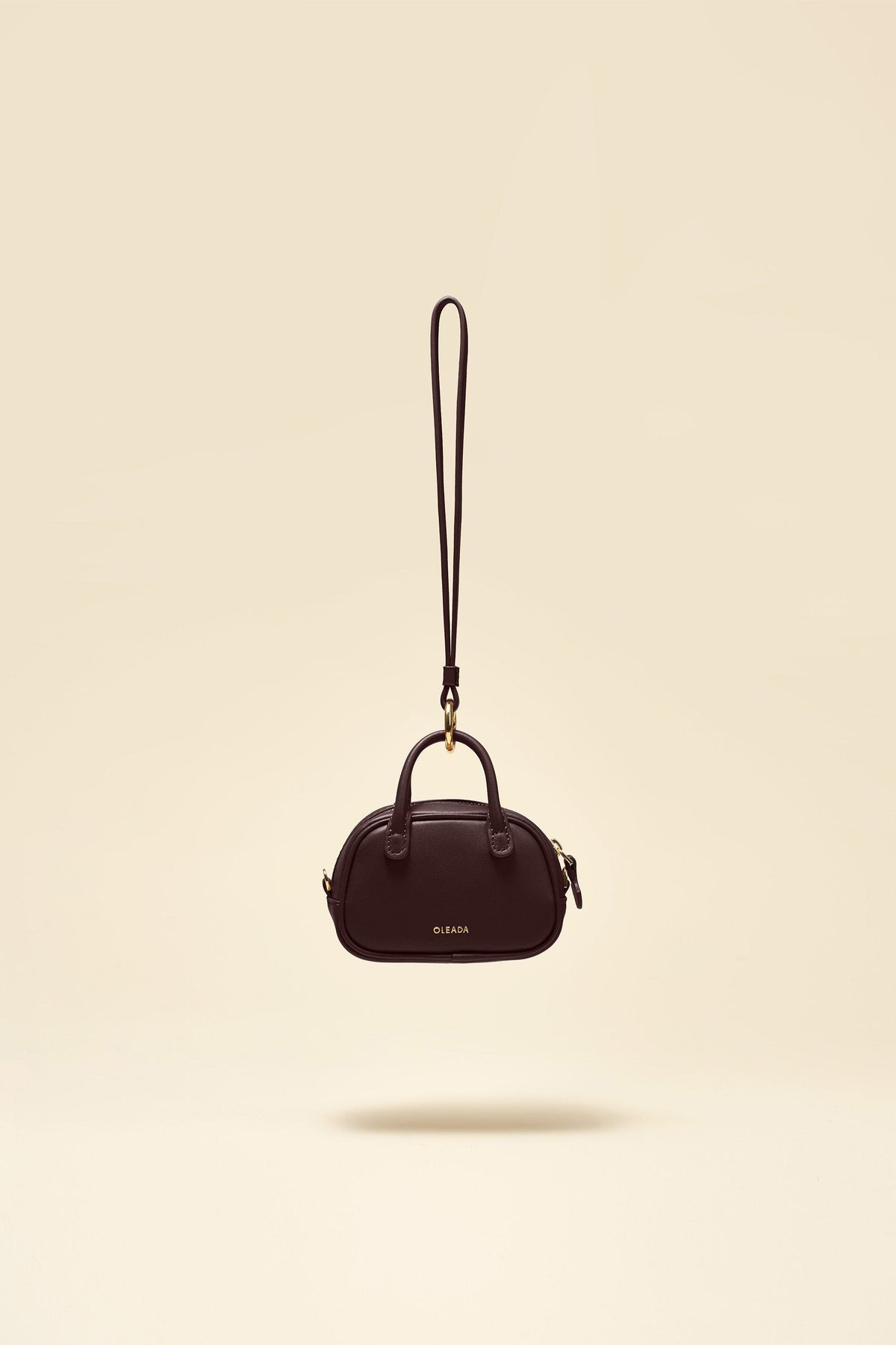 OLEADA NYC Apparel and Accessories > Women > Small Leather Goods > Leather Case Color_Chocolate Marina Carryall Charm